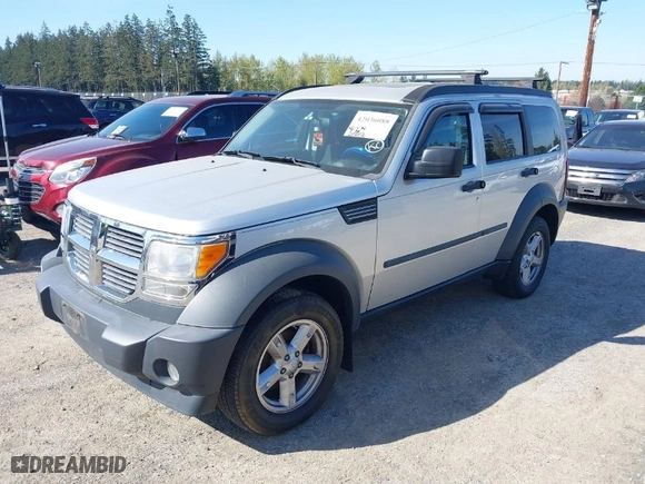 2007 Dodge Nitro SXT with VIN 1D8GU28K87W581969, listed as a IAAI auction lot 42036088 with 128,382 mi miles. Bid and sale history available at carsss.com. Image 2.