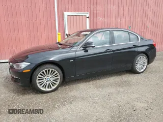 2012 BMW 3 Series 328i with VIN WBA3A5C57CF345040, listed as a Copart auction lot 63761735 with 106,665 mi miles and Clean title. Bid and sale history available at DreamBid. Image 1.