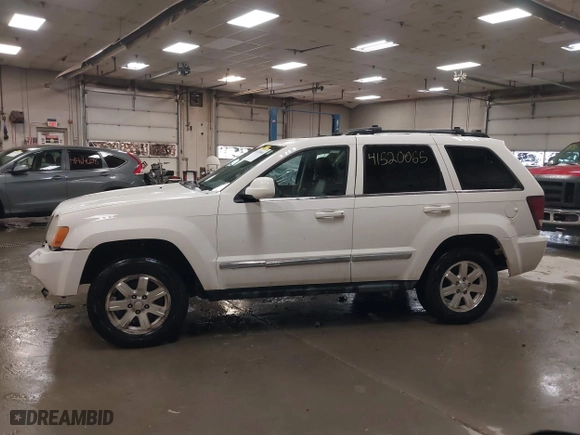 2009 Jeep Grand Cherokee Limited with VIN 1J8GR58K29C553812, listed as a IAAI auction lot 41520065 with 203,595 mi miles. Bid and sale history available at carsss.com. Image 12.