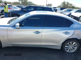 2014 Infiniti Q50 Sport with VIN JN1BV7AR7EM701783, listed as a IAAI auction lot 41757085 with 115,352 mi miles and . Bid and sale history available at DreamBid. Image 14.