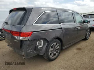 2015 Honda Odyssey Touring Elite z VIN 5FNRL5H96FB047204, wystawiony jako Copart lot #56297985 z przebiegiem 125 482 mil mil oraz Szkoda całkowita • Salvage title. Historia ofert i sprzedaży dostępna na DreamBid. Obrazek 3.