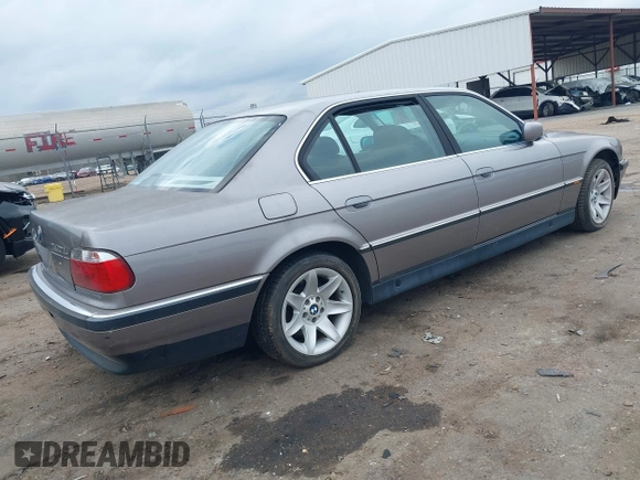 1998 BMW 7 Series 740il with VIN WBAGJ8323WDM23239, listed as a IAAI auction lot 41512630 with 221,673 mi miles. Bid and sale history available at carsss.com. Image 4.