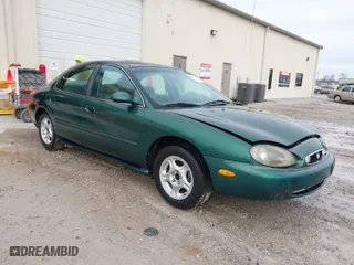 1999 Mercury Sable GS with VIN 1MEFM50U5XG633589, listed as a IAAI auction lot 41614442 with 241,833 mi miles. Bid and sale history available at carsss.com. Image 1.