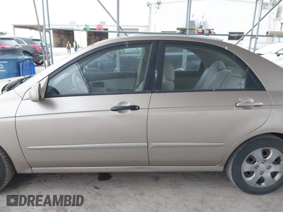2004 Kia Spectra LX with VIN KNAFE121245064294, listed as a IAAI auction lot 41424241 with 110,136 mi miles. Bid and sale history available at carsss.com. Image 14.