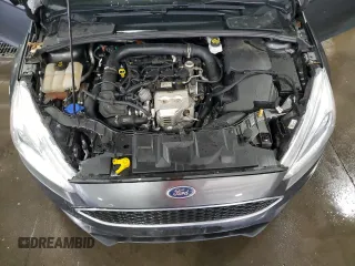 2018 Ford Focus SE z VIN 1FADP3FE4JL289830, wystawiony jako Copart lot #53350265 z przebiegiem 72 963 mil mil oraz Szkoda całkowita • Salvage title. Historia ofert i sprzedaży dostępna na DreamBid. Obrazek 11.