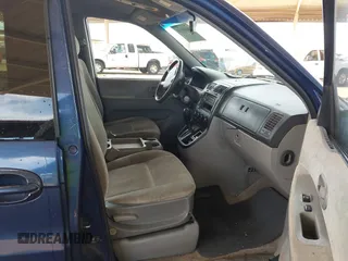 2005 Kia Sedona LX with VIN KNDUP132X56697388, listed as a IAAI auction lot 40695710 with 217,116 mi miles. Bid and sale history available at carsss.com. Image 5.