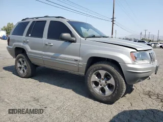 2001 Jeep Grand Cherokee Limited with VIN 1J4GW58N11C721108, listed as a Copart auction lot 60176915 with 257,907 mi miles and Salvage title. Bid and sale history available at DreamBid. Image 4.