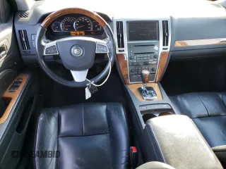 2009 Cadillac STS AWD z VIN 1G6DD67VX90138316, wystawiony jako Copart lot #80915524 z przebiegiem 112 290 mil mil oraz Czysty tytuł • Clean title. Historia ofert i sprzedaży dostępna na DreamBid. Obrazek 8.