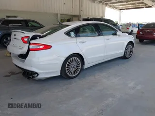 2016 Ford Fusion Titanium with VIN 3FA6P0K96GR390989, listed as a IAAI auction lot 42634275 with 123,559 mi miles and . Bid and sale history available at DreamBid. Image 4.