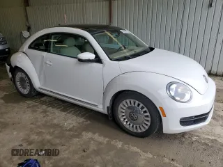 2014 Volkswagen Beetle 2.5L w/Sun with VIN 3VWJP7AT1EM612064, listed as a Copart auction lot 48005055 with 62,290 mi miles and Salvage Title. Bid and sale history available at DreamBid. Image 4.