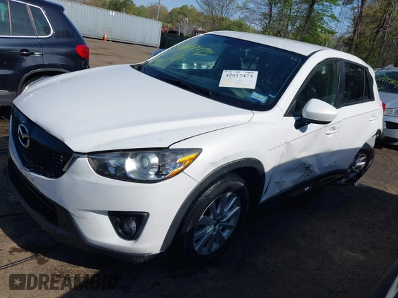 2014 Mazda CX-5 Touring with VIN JM3KE2CY5E0329783, listed as a IAAI auction lot 42017473 with 121,175 mi miles. Bid and sale history available at carsss.com. Image 2.