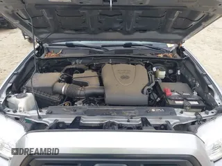 2018 Toyota Tacoma SR with VIN 3TMCZ5AN4JM130307, listed as a IAAI auction lot 41541477 with 74,369 mi miles and . Bid and sale history available at DreamBid. Image 10.