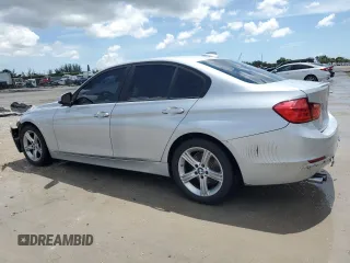 2013 BMW 3 Series 328i with VIN WBA3C1G52DNR49440, listed as a Copart auction lot 61546685 with 118,308 mi miles and Salvage title. Bid and sale history available at DreamBid. Image 2.