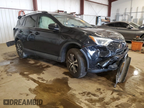 2018 Toyota RAV4 LE with VIN 2T3BFREV7JW717699, listed as a Copart auction lot 60656045 with Not provided miles and Salvage title. Bid and sale history available at DreamBid. Image 4.