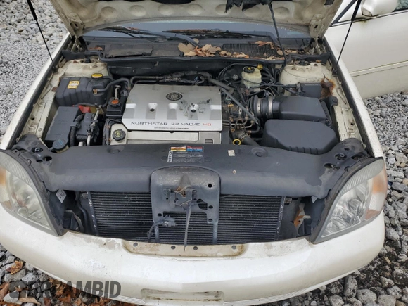 2000 Cadillac DeVille DTS z VIN 1G6KF5797YU263599, wystawiony jako Copart lot #81576484 z przebiegiem 118 414 mil mil oraz Szkoda całkowita • Salvage title. Historia ofert i sprzedaży dostępna na DreamBid. Obrazek 11.