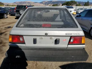 1986 Toyota Tercel z VIN JT2AL31G5G0429131, wystawiony jako Copart lot #79204554 z przebiegiem 124 477 mil mil oraz Szkoda całkowita • Salvage title. Historia ofert i sprzedaży dostępna na DreamBid. Obrazek 6.
