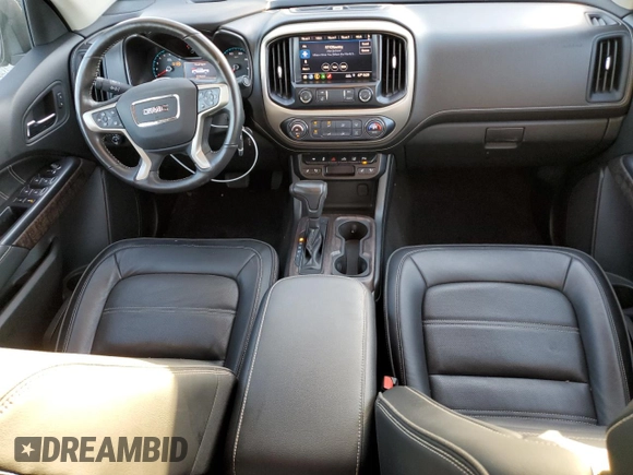 2021 GMC Canyon 2WD Denali with VIN 1GTG5EEN2M1107052, listed as a Copart auction lot 76377704 with 11,696 mi miles and Salvage Title. Bid and sale history available at carsss.com. Image 8.