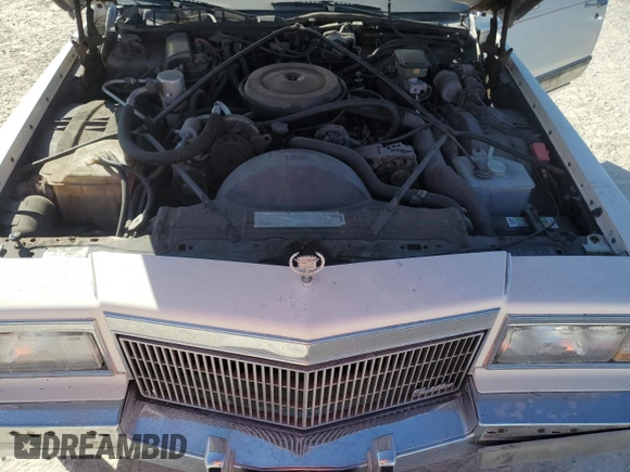 1990 Cadillac Brougham z VIN 1G6DW54Y6LR711203, wystawiony jako Copart lot #76484634 z przebiegiem 121 310 mil mil oraz Nie do naprawy. Historia ofert i sprzedaży dostępna na DreamBid. Obrazek 11.