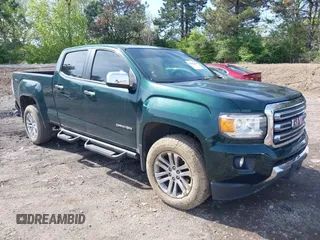 2015 GMC Canyon 4WD SLT z VIN 1GTG6CE36F1122477, wystawiony jako IAAI lot #42102590 z przebiegiem 124 320 mil mil oraz . Historia ofert i sprzedaży dostępna na DreamBid. Obrazek 1.