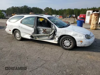 1999 Ford Taurus SE z VIN 1FAFP58S0XA272714, wystawiony jako Copart lot #48966215 z przebiegiem 255 885 mil mil oraz Szkoda całkowita • Salvage title. Historia ofert i sprzedaży dostępna na DreamBid. Obrazek 4.