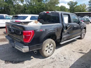 2021 Ford F-150 XL with VIN 1FTFW1E5XMKE21429, listed as a IAAI auction lot 40347406 with 125,000 mi miles. Bid and sale history available at carsss.com. Image 4.