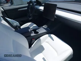 2023 Tesla Model 3 z VIN 5YJ3E1EA7PF413311, wystawiony jako IAAI lot #42442055 z przebiegiem 25 270 mil mil oraz . Historia ofert i sprzedaży dostępna na DreamBid. Obrazek 5.