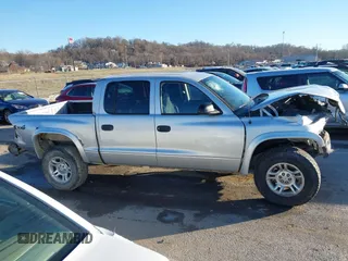 2004 Dodge Dakota Sport with VIN 1D7HG38K34S561735, listed as a IAAI auction lot 41409622 with Not Provided miles and . Bid and sale history available at carsss.com. Image 13.