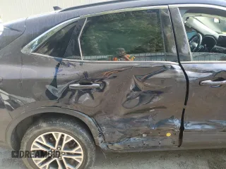2021 Ford Escape SEL Hybrid z VIN 1FMCU9CZ7MUA94260, wystawiony jako Copart lot #71013514 z przebiegiem Nie podano mil oraz Szkoda całkowita • Salvage title. Historia ofert i sprzedaży dostępna na DreamBid. Obrazek 11.
