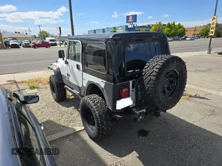 1993 Jeep Wrangler S z VIN 1J4FY19P5PP261872, wystawiony jako Copart lot #58435955 z przebiegiem 127 959 mil mil oraz Czysty tytuł • Clean title. Historia ofert i sprzedaży dostępna na DreamBid. Obrazek 3.