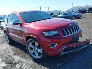 2014 Jeep Grand Cherokee Overland with VIN 1C4RJFCG2EC216406, listed as a IAAI auction lot 41944794 with 124,007 mi miles. Bid and sale history available at carsss.com. Image 1.