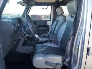 2007 Jeep Wrangler Unlimited Sahara with VIN 1J4GB59197L144781, listed as a Copart auction lot 48678315 with 137,538 mi miles and Salvage title. Bid and sale history available at DreamBid. Image 7.