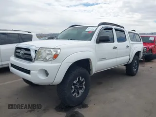 2009 Toyota Tacoma PreRunner with VIN 3TMJU62N49M076433, listed as a IAAI auction lot 41902369 with 164,827 mi miles. Bid and sale history available at carsss.com. Image 2.