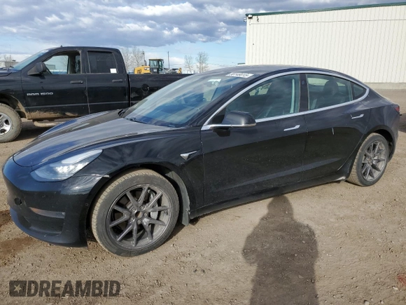 2019 Tesla Model 3 Mid Range z VIN 5YJ3E1EA7KF420025, wystawiony jako Copart lot #56149015 z przebiegiem 253 771 mil mil oraz Szkoda całkowita • Salvage title. Historia ofert i sprzedaży dostępna na DreamBid. Obrazek 1.