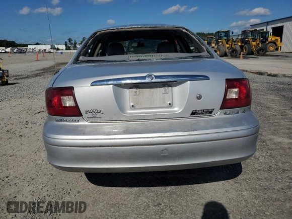 2003 Mercury Sable LS with VIN 1MEHM55S73A619013, listed as a Copart auction lot 73504154 with 200,135 mi miles and Salvage Title. Bid and sale history available at DreamBid. Image 6.