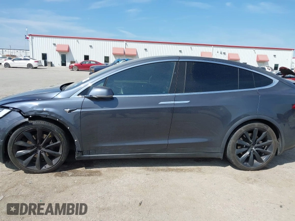 2017 Tesla Model X 90D with VIN 5YJXCBE22HF079194, listed as a IAAI auction lot 41895591 with 102,437 mi miles and . Bid and sale history available at DreamBid. Image 14.
