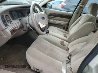 2004 Mercury Grand Marquis GS with VIN 2MEFM74W44X659873, listed as a Copart auction lot 51793205 with 115,384 mi miles and Salvage Title. Bid and sale history available at DreamBid. Image 7.