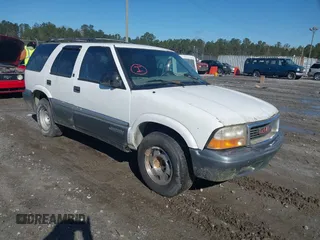1999 GMC Jimmy SL with VIN 1GKCS13W9X2518799, listed as a IAAI auction lot 41724362 with 1 mi miles. Bid and sale history available at carsss.com. Image 1.