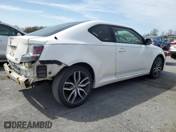 2014 Scion tC z VIN JTKJF5C70E3084697, wystawiony jako Copart lot #54307295 z przebiegiem 174 073 mil mil oraz Szkoda całkowita • Salvage title. Historia ofert i sprzedaży dostępna na DreamBid. Obrazek 3.