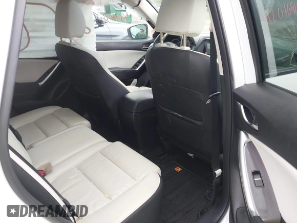 2016 Mazda CX-5 Grand Touring z VIN JM3KE4DY0G0705884, wystawiony jako IAAI lot #42016910 z przebiegiem 73 324 mil mil oraz . Historia ofert i sprzedaży dostępna na DreamBid. Obrazek 8.