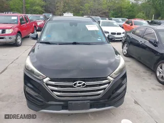 2017 Hyundai Tucson Value with VIN KM8J33A26HU362363, listed as a IAAI auction lot 41940376 with 127,986 mi miles. Bid and sale history available at carsss.com. Image 12.