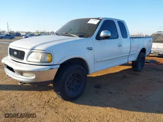 1998 Ford F-150 Standard with VIN 1FTZX18W4WKB71994, listed as a IAAI auction lot 41450074 with 202,784 mi miles. Bid and sale history available at carsss.com. Image 2.