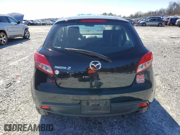 2012 Mazda 2 Sport with VIN JM1DE1KZ2C0149132, listed as a Copart auction lot 45177385 with 146,966 mi miles and Salvage Title. Bid and sale history available at DreamBid. Image 6.
