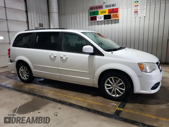 2014 Dodge Grand Caravan SXT z VIN 2C4RDGCGXER138025, wystawiony jako Copart lot #57941985 z przebiegiem 87 055 mil mil oraz Szkody całkowita. Historia ofert i sprzedaży dostępna na DreamBid. Obrazek 4.