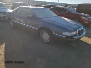 1993 Cadillac Eldorado z VIN 1G6EL12B1PU616913, wystawiony jako Copart lot #80311794 z przebiegiem 174 556 mil mil oraz Szkoda całkowita • Salvage title. Historia ofert i sprzedaży dostępna na DreamBid. Obrazek 4.