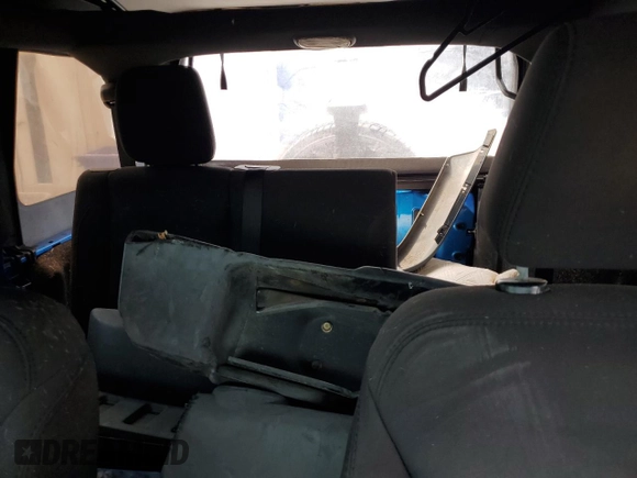 2015 Jeep Wrangler Unlimited Willys Wheeler with VIN 1C4BJWDG4FL611656, listed as a Copart auction lot 54010395 with 129,797 mi miles and Salvage Title. Bid and sale history available at DreamBid. Image 10.