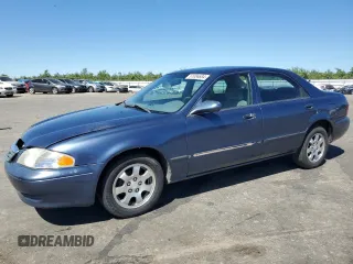 2002 Mazda 626 LX with VIN 1YVGF22C825293243, listed as a Copart auction lot 61084684 with 217,339 mi miles and Salvage Title. Bid and sale history available at carsss.com. Image 1.