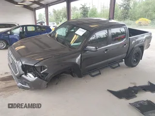 2019 Toyota Tacoma SR z VIN 3TMCZ5AN1KM257081, wystawiony jako IAAI lot #42211385 z przebiegiem 60 229 mil mil oraz . Historia ofert i sprzedaży dostępna na DreamBid. Obrazek 18.