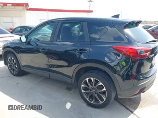 2016 Mazda CX-5 Grand Touring z VIN JM3KE2DY2G0765444, wystawiony jako IAAI lot #42527577 z przebiegiem 162 871 mil mil oraz . Historia ofert i sprzedaży dostępna na DreamBid. Obrazek 14.