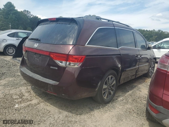 2014 Honda Odyssey Touring with VIN 5FNRL5H95EB067703, listed as a Copart auction lot 71066034 with 0 mi miles and Salvage Title. Bid and sale history available at carsss.com. Image 4.