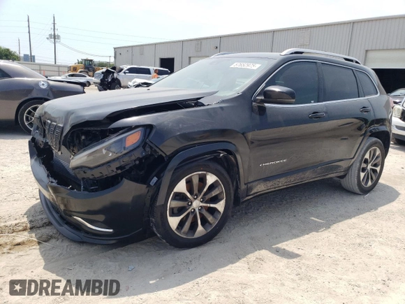 2019 Jeep Cherokee z VIN 1C4PJLJN0KD215834, wystawiony jako Copart lot #57652975 z przebiegiem 127 986 mil mil oraz Czysty tytuł • Clean title. Historia ofert i sprzedaży dostępna na DreamBid. Obrazek 1.